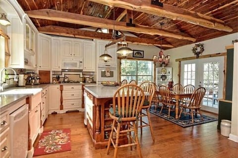 Big House Kitchen w island and breakfast table.