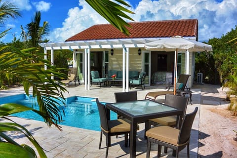 Experience the epitome of privacy with a cottage that boasts a personal pool and outdoor dining on the patio