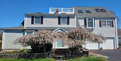 Front with main house on left, in law apt on right above garage with roof-deck