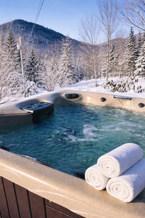 Private outdoor hot tub with mountain views