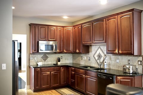 Full kitchen as seen from garage entrance