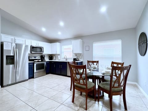 Stainless steel appliances and quartz countertops.