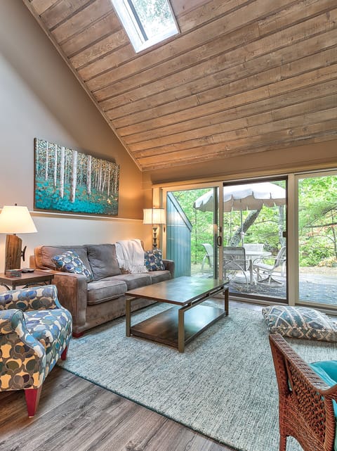 Lovely view from the living room of the woods beyond the patio.