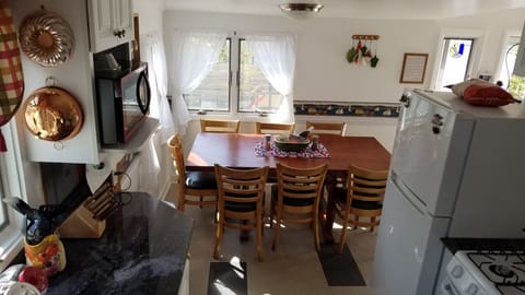 cozy kitchen with most things you'd need - toaster, blender, waffle iron!