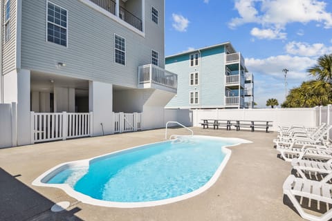 Take an evening dip in the pool after a fun day at the beach.