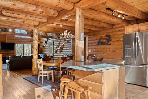 Breakfast bar seats 4, has big prep area and faces the dining and great rooms