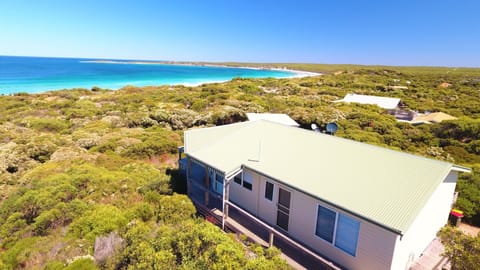 Aerial shot of Ocean View sitting high amongst lush coastal vegetation