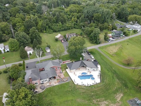 Home on the left.  Pool and pavilion on the right.