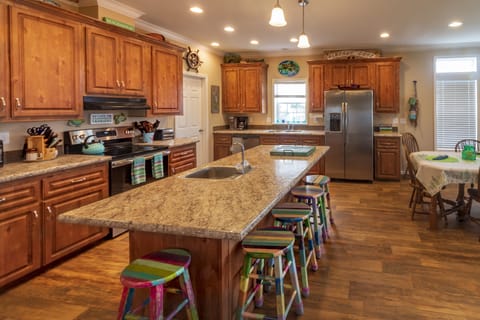 Kitchen island, with prep sink, bar seating for 5 (and 2 extras plus high chair)