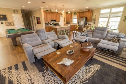 Den, 2 reclining sofas, 65 inch TV, Stereo with remote speakers, DVD, canal view