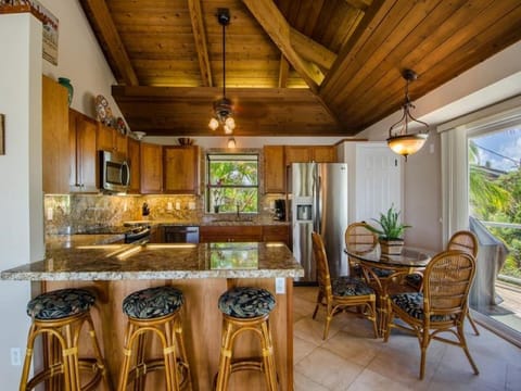 Upstairs kitchen with granite counters & stainless steel appliances