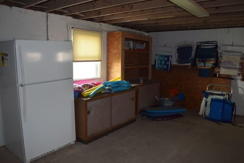 Below house fridge and beach gear storage