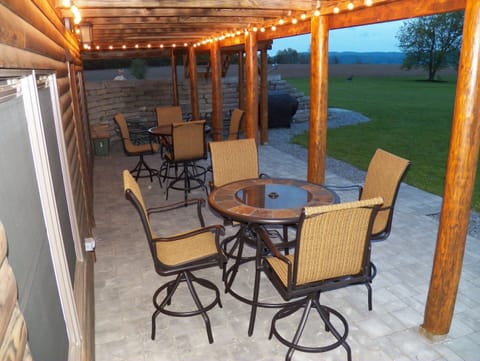 Covered Patio/Grilling area with lots of seating and lighting for night time.