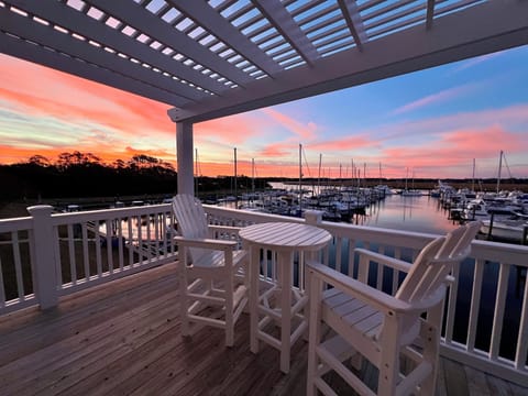 The balcony overlooks the peaceful harbor