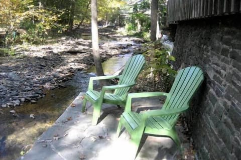 Relax on the lower level patio next to the flowing water.