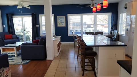 Kitchen and living room area with view of first floor deck and canal.
