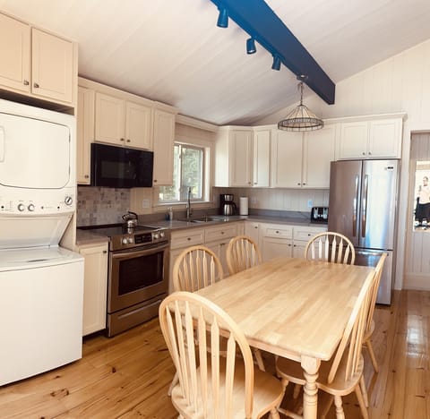 Newly renovated kitchen with custom cabinets and quarts countertop.  