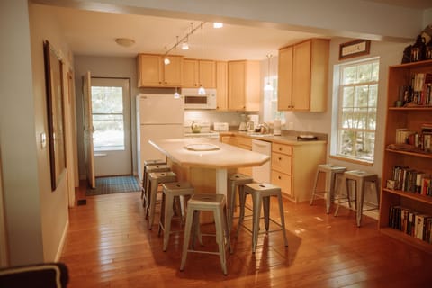 gourmet kitchen stocked with every cooking utensil and pan needed