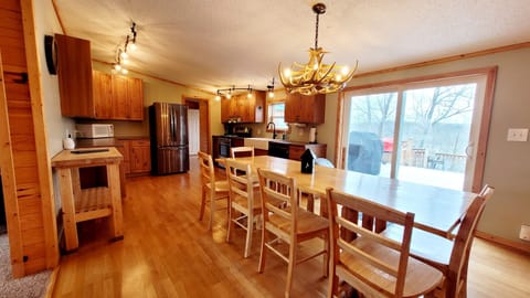 A well stocked kitchen with easy access the spacious deck.