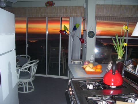 Kitchen at sunset, no dishwasher and small, but what a view