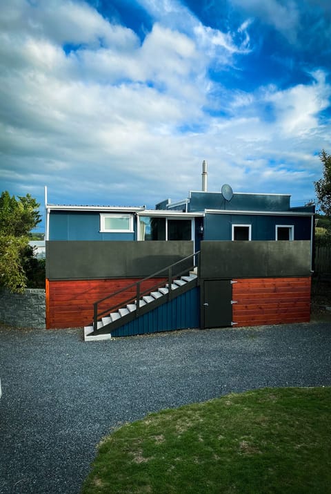 13 steps up to entry door, width of house is all decking