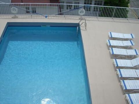 Sparkling Swimming Pool with newly painted deck and new patio furniture