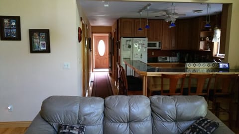 Kitchen has easy access to living room area. Stay in touch while cooking!