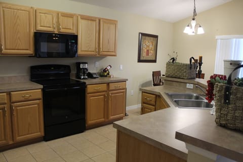 Kitchen- includes electrical stove, convection oven, microwave & fridge