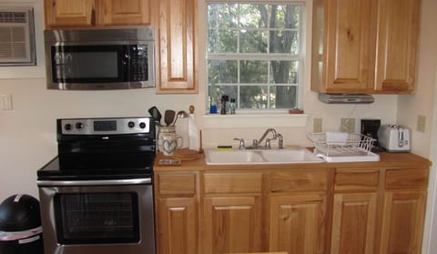 Kitchen- stove, mircowave, coffee maker and toaster.  Also, pot and pans.