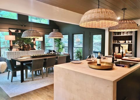 Beautiful micrcrete kitchen island viewing into luxurious RH dining room