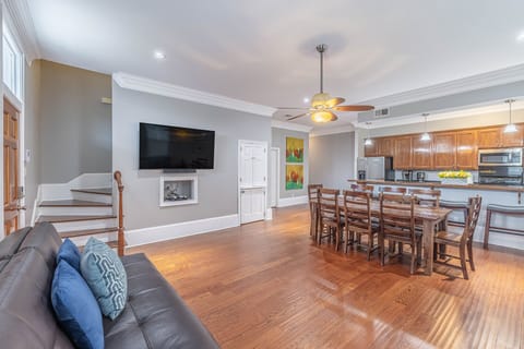 Opening living room plan featuring 70' Smart TV