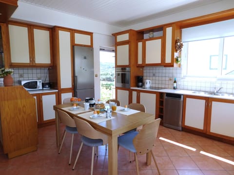 Villa Almarine upstairs kitchen with door to side balcony.