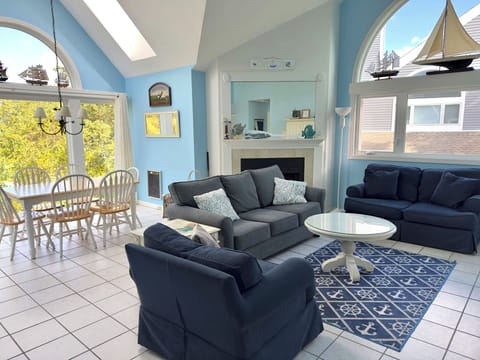 Living/dining room with view of 9th hole. Skylights. So bright and attractive.