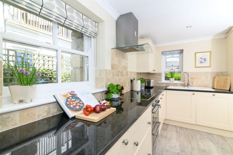 Bright, well equipped kitchen with stable door to garden.