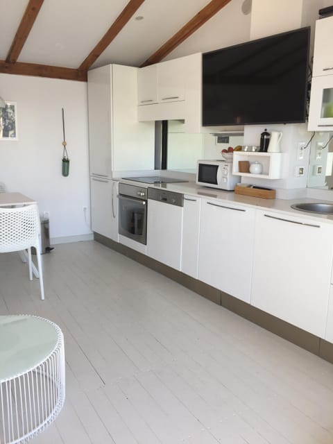 Fully equipped kitchen on the top floor for entertaining on the terrace