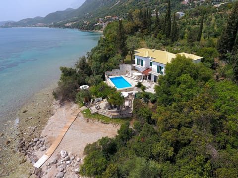 Seafront Villa Alexia with private beach access and infinity pool terrace.