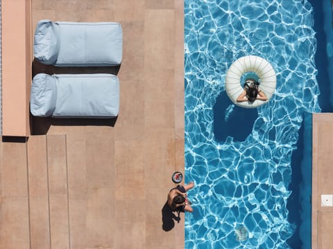 Large private swimming pool with sun loungers