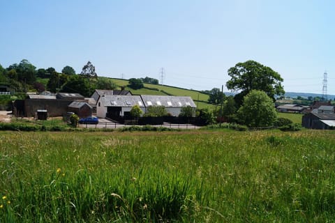 Lower Curscombe Barn, a beautiful conversion of a 400-year-old threshing barn, comprises two adjacent properties together sleeping 12