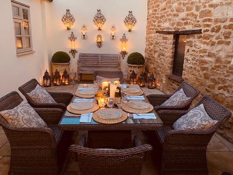 Gorgeous sunny courtyard by day and at night it almost becomes Mediterranean. 