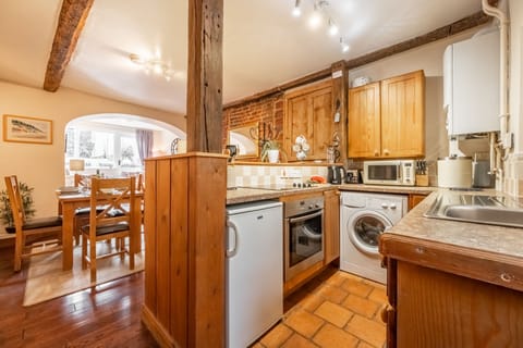 Ground floor: Kitchen with dining area beyond