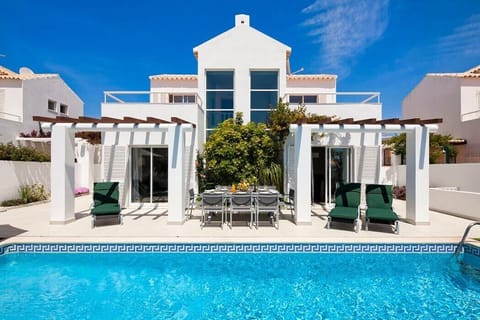 Pool and house