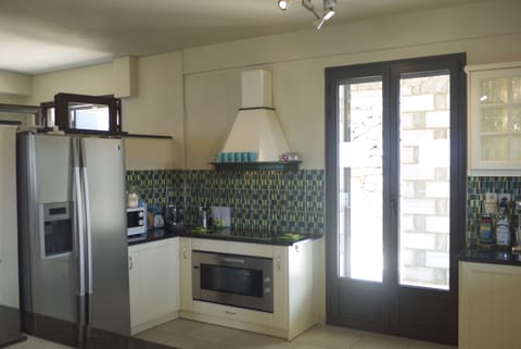 American fridge freezer, wide oven and hob, microwave oven