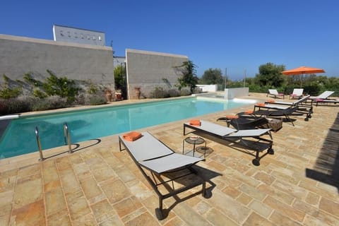 Relax on one of the many sun loungers around the pool area