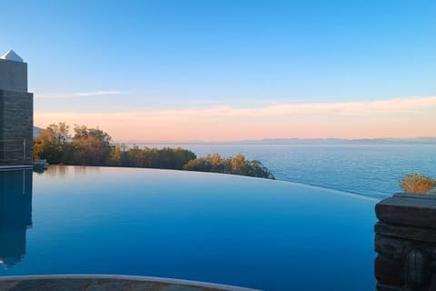 Infinity pool overlooking the sea at sunset