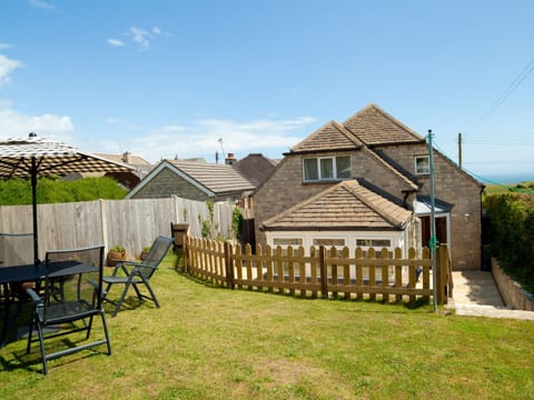 Rear of House -  enclosed garden- sea views and plenty of garden furniture