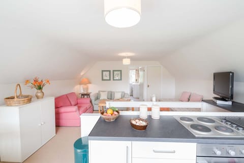 Living area with  view to separate bedroom