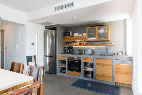 Fully equipped kitchen of top quality fixtures and appliances in both villas