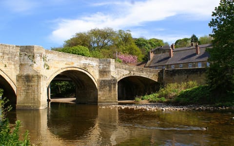 Riverside Cottage is set next to the River Coquet in a popular Village