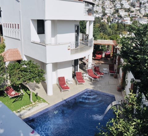 The outside and beautiful pool of Villa Kirmizi lale