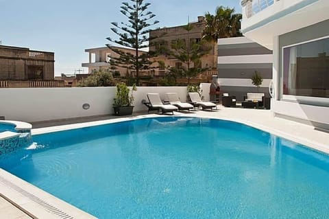Relax and Sunbathing Area (Pool standard temperature of 27 Degrees as per Malta Law)